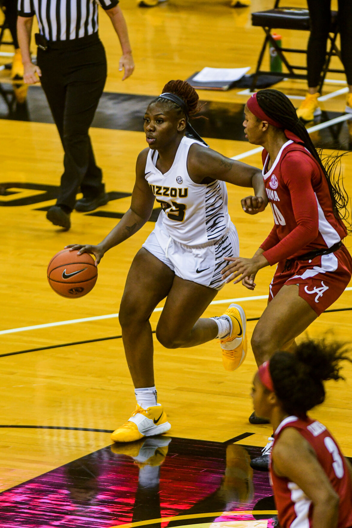 University of Missouri guard Aijha Blackwell dribbles past Alabama forward Jasmine Walker
